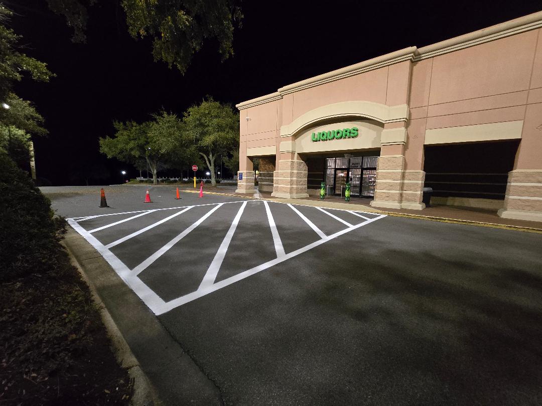 Safety First: Crosswalk Striping Project Completed in Parking Lot by Brynco Home Improvements LLC in Pensacola, FL