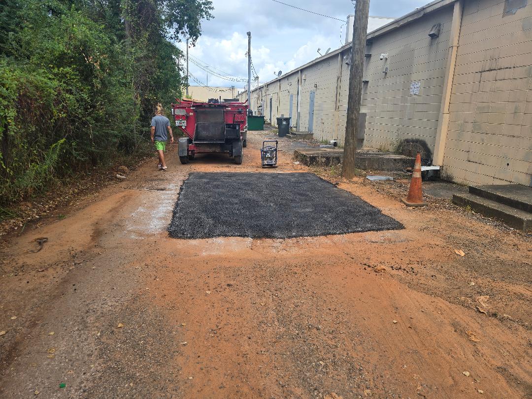 Strong & Seamless: Asphalt Cut-Out Repairs with Hot Asphalt Completed by Brynco Home Improvements in Pensacola, FL